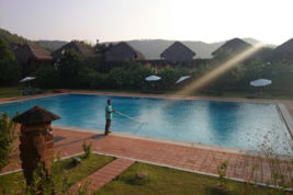 man-cleaning-pool.jpg man cleaning pool